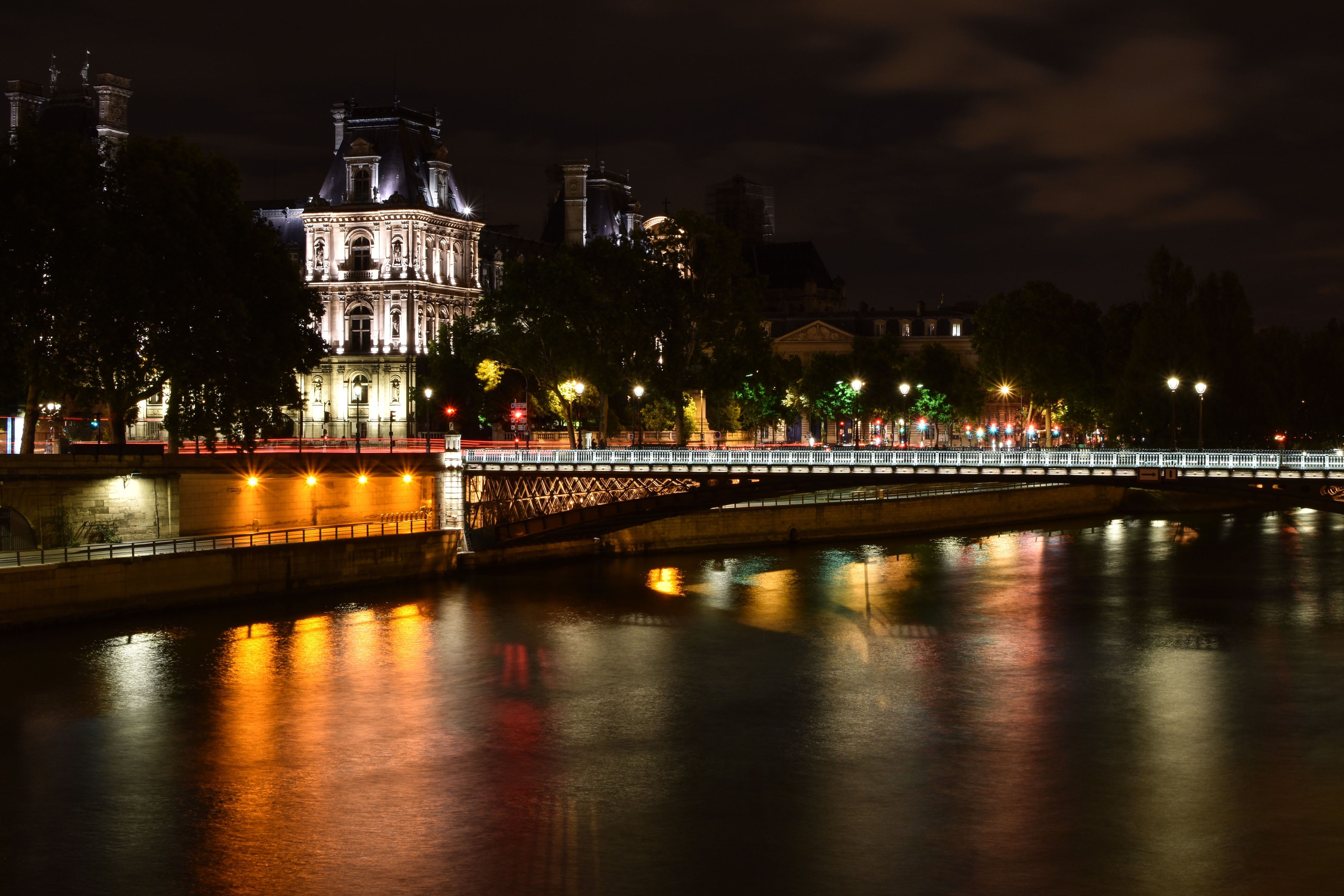 The Eiffel Tower illuminated at night with river reflections in Paris for New Year's Eve